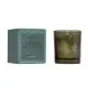 Bougie parfumée Tender Affection en verre vert fumé siglé Wellmark, à côté de son étui vert à motif géométrique