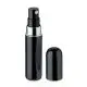 Vaporisateur de parfum personnalisé noir brillant en aluminium avec bague argentée et capuchon posé à côté