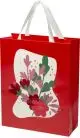 Sac en papier personnalisé rouge avec anses en ruban blanc et motif floral sur fond crème