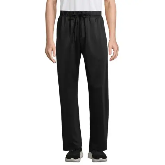 Pantalon de survêtement personnalisé noir en polyester recyclé porté de face, coupe droite et cordon ton sur ton