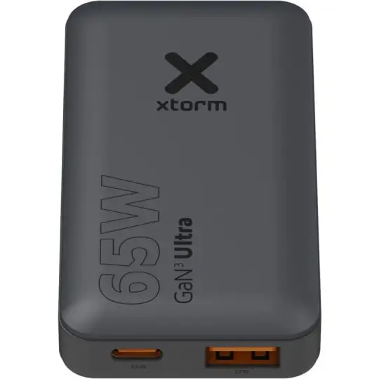 Chargeur de voyage publicitaire Xtorm 65 W GaN gris anthracite avec ports USB-C et USB-A à liseré orange
