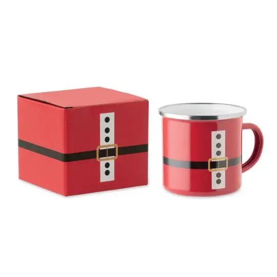 Mug émaillé rouge au décor de costume de Père Noël, ceinture noire et boucle dorée, à côté de sa boîte cadeau assortie