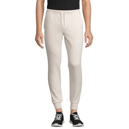 Pantalon de jogging personnalisé JUMBO écru porté de face avec cordon de serrage et bas de jambe resserrés en côte