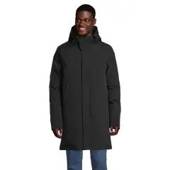 Parka personnalisée homme noire longue à capuche rembourrée et patte de fermeture, portée avec un jean, vue de face